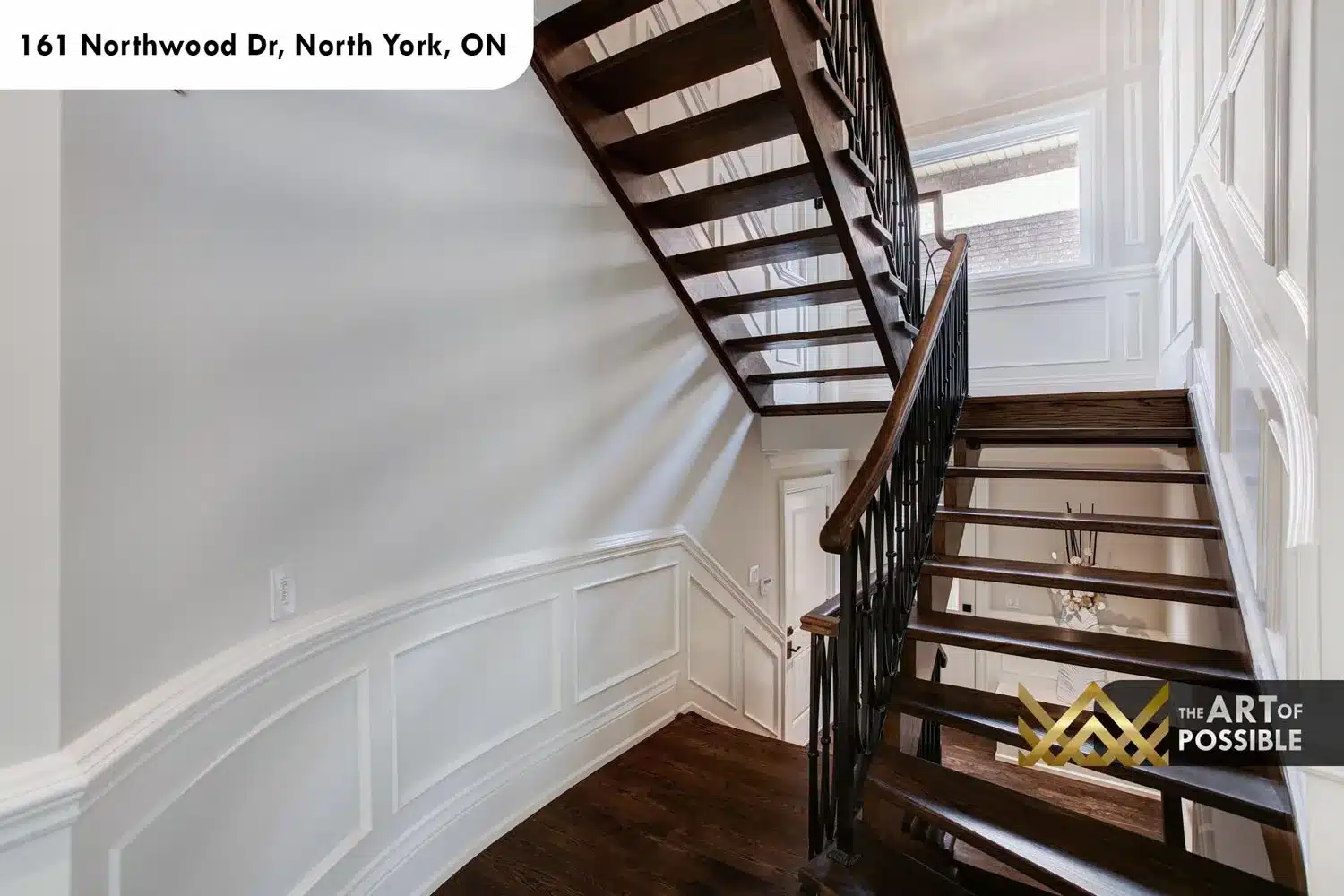 161 Northwood Dr North York staircase open tread dark oak wrought iron scroll balusters wainscoting