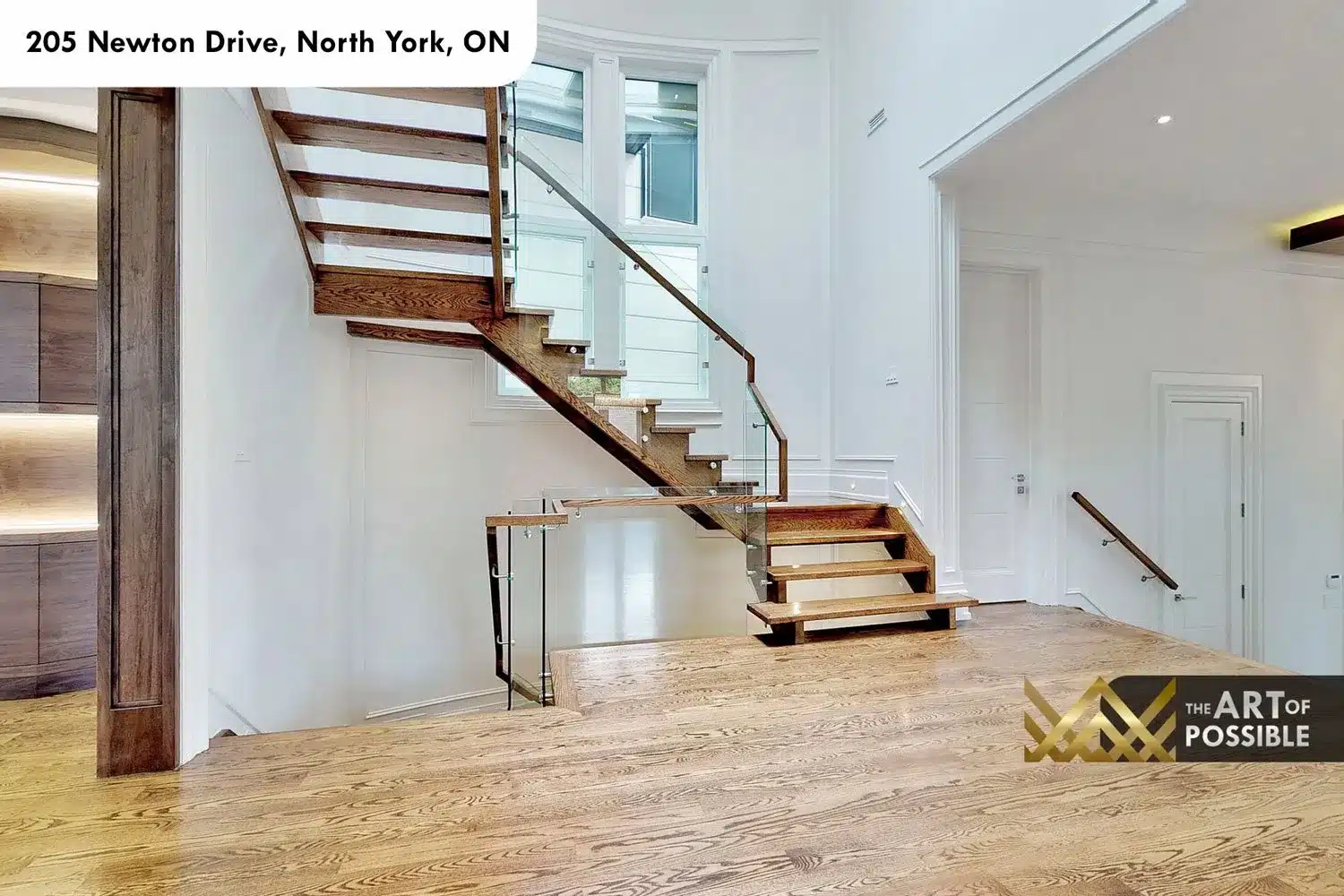 205 Newton Drive open-tread oak staircase glass railings three storeys