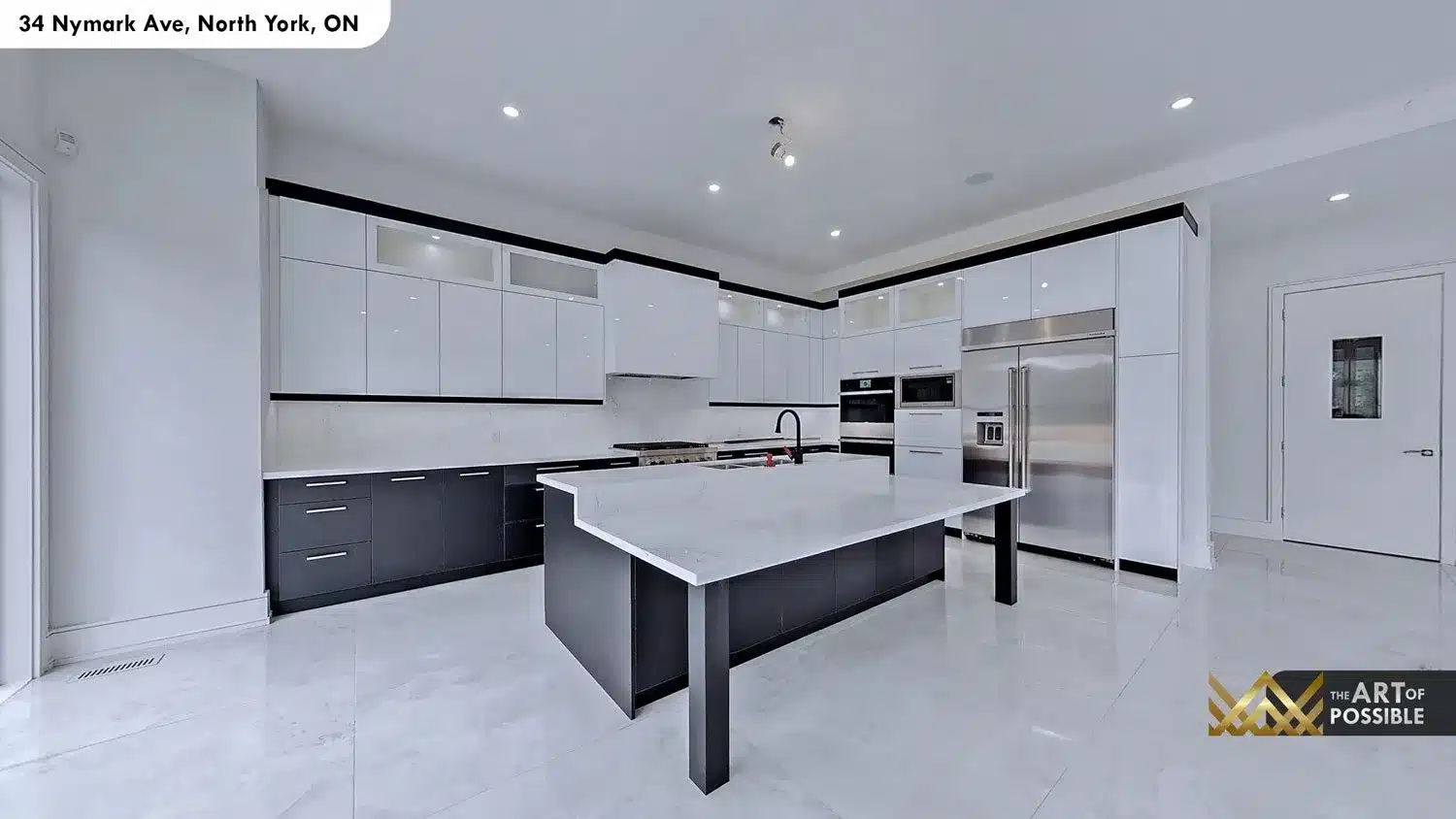 Kitchen panoramic view showing white upper cabinets, charcoal lower cabinets, island and stainless appliances