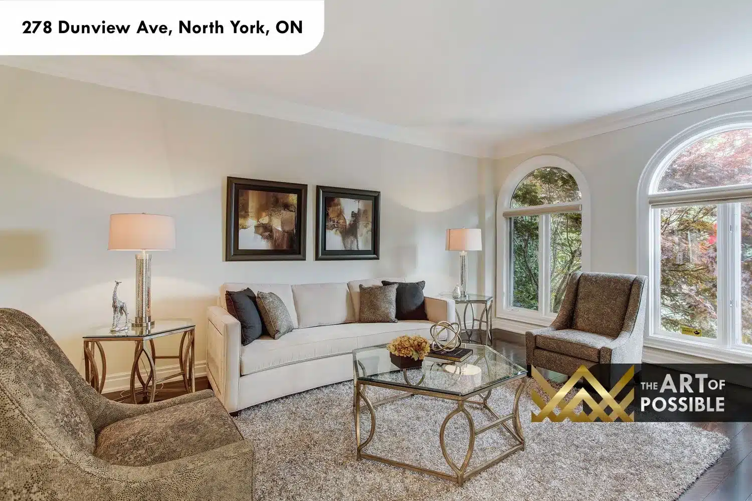 Formal living room at 278 Dunview Ave, arched window, dark hardwood floors, crown moulding