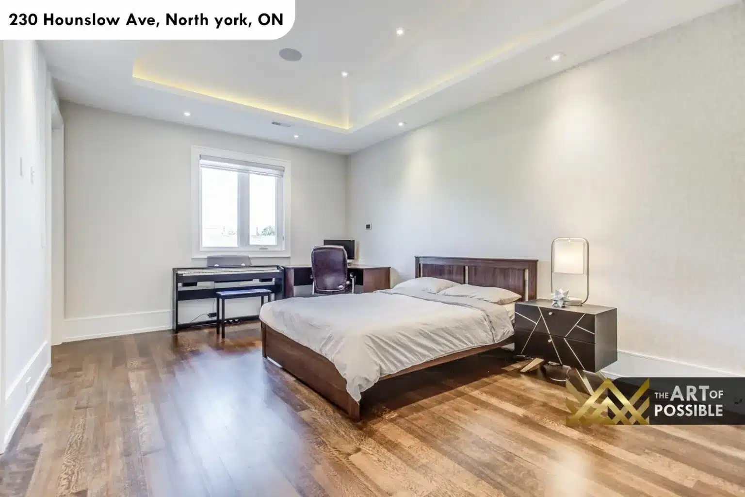 Secondary bedroom with tray ceiling LED cove and walnut bed frame