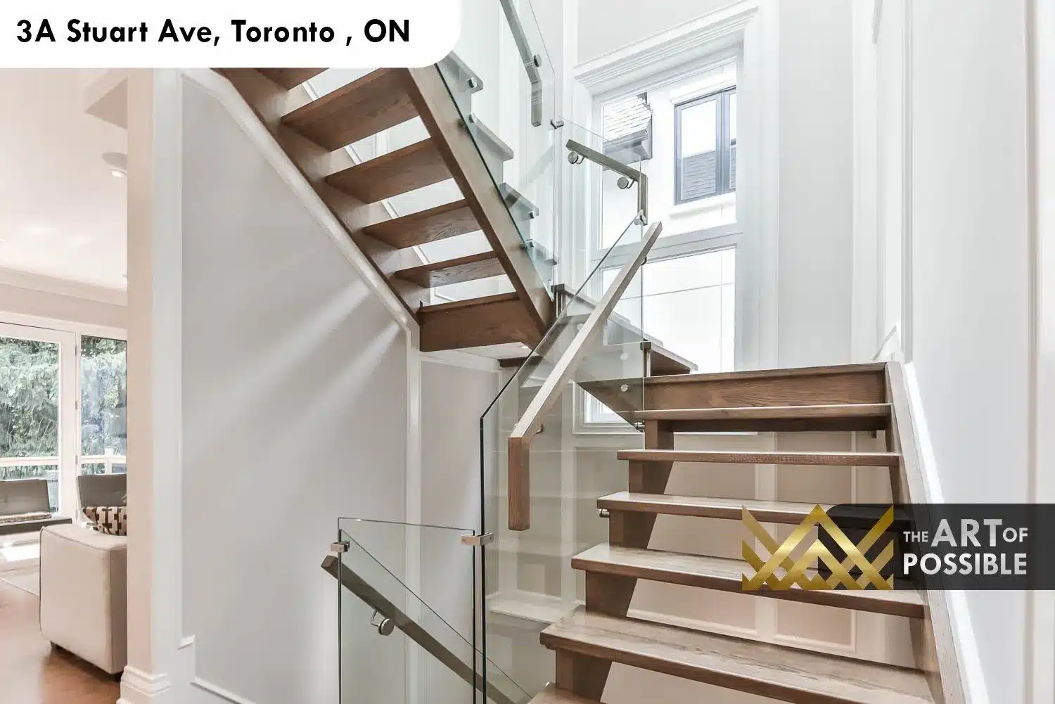 Glass-railed staircase at 3A Stuart Ave showing open oak treads and multi-storey run