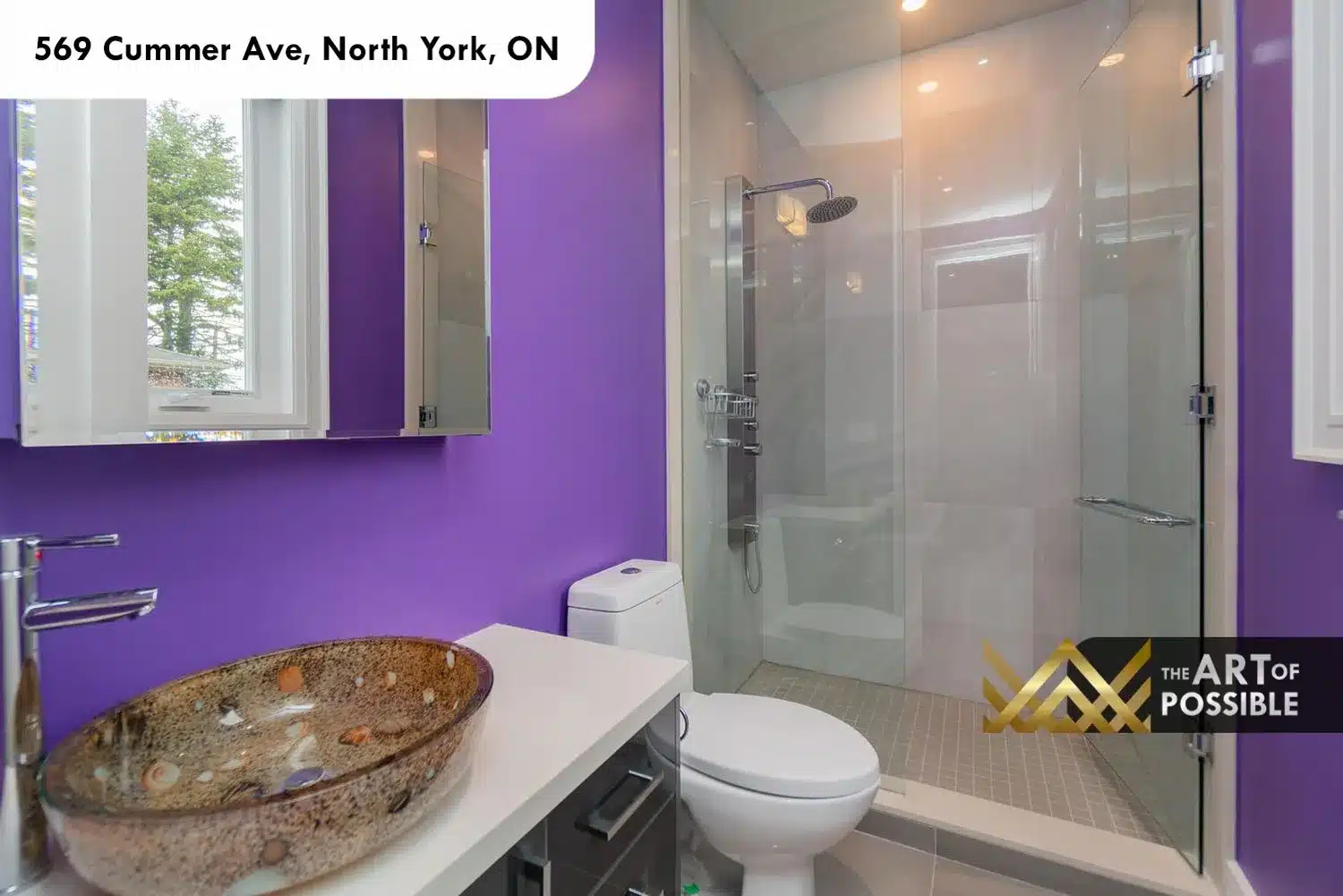 569 Cummer Ave bathroom purple accent walls art glass vessel sink glass shower rain head