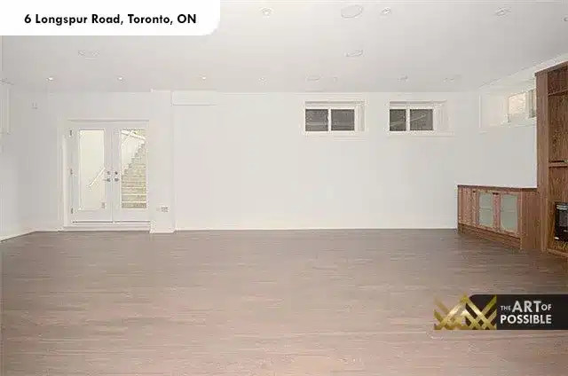 Finished lower-level rec room with walkout door and built-in entertainment unit at 6 Longspur Rd Toronto