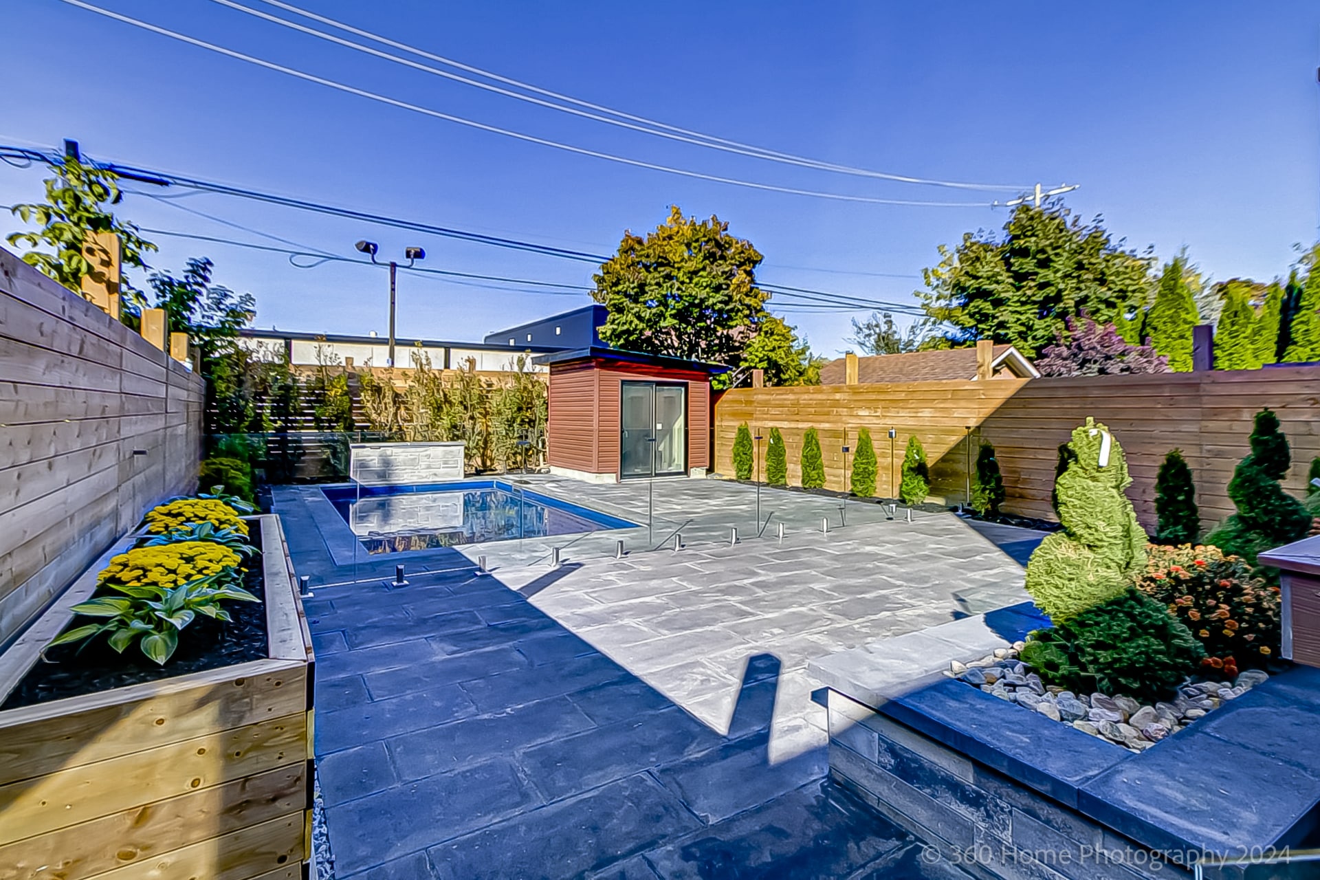 Overhead view of in-ground pool and landscaped backyard at 100 Glenvale Blvd