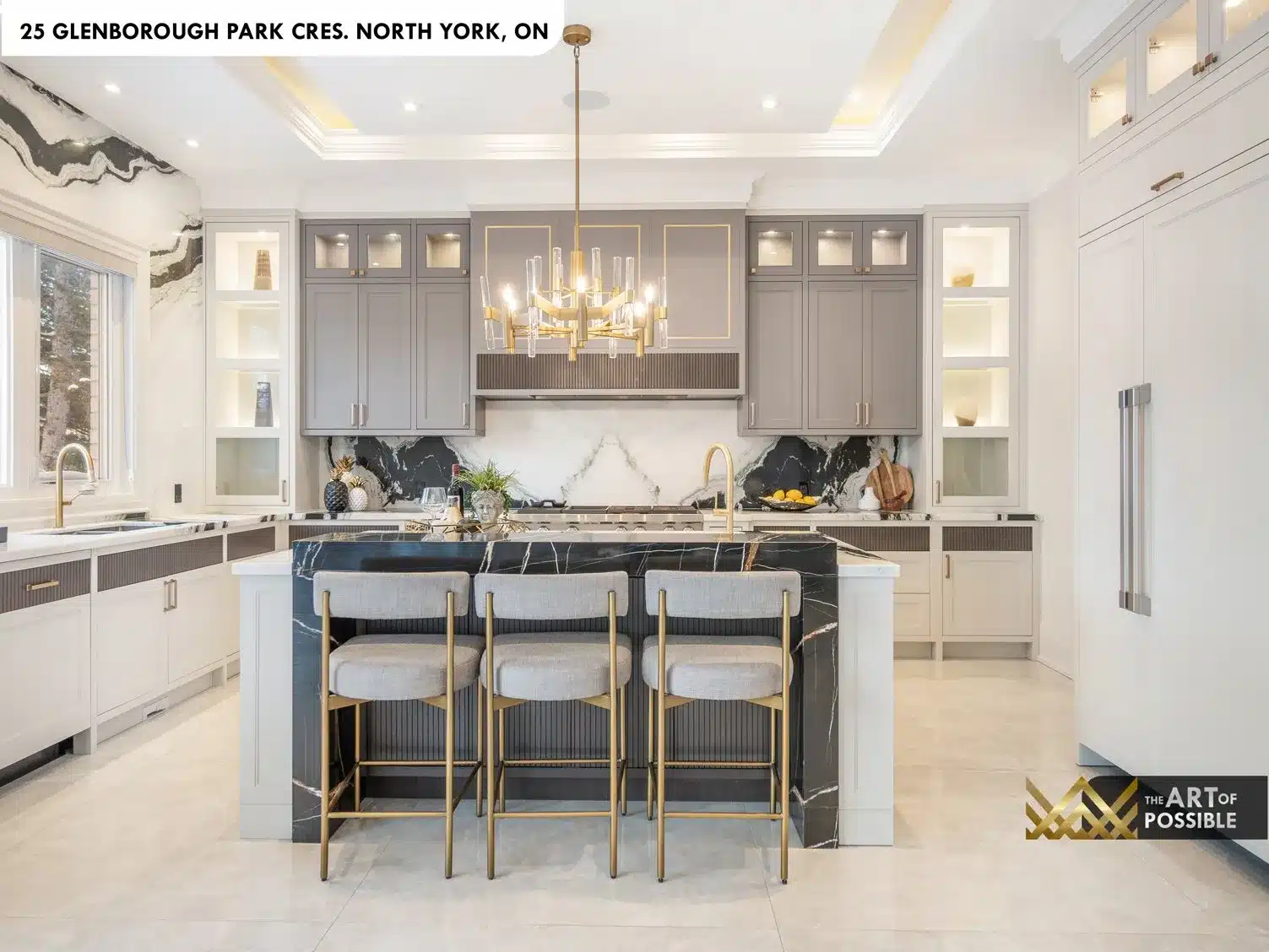 Kitchen island waterfall stone slab and globe pendant lighting