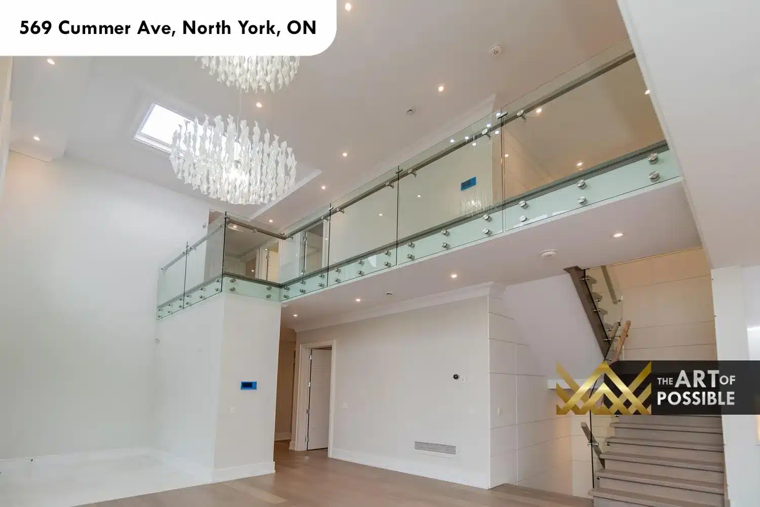 569 Cummer Ave double height foyer glass railings sculptural capiz chandelier skylight