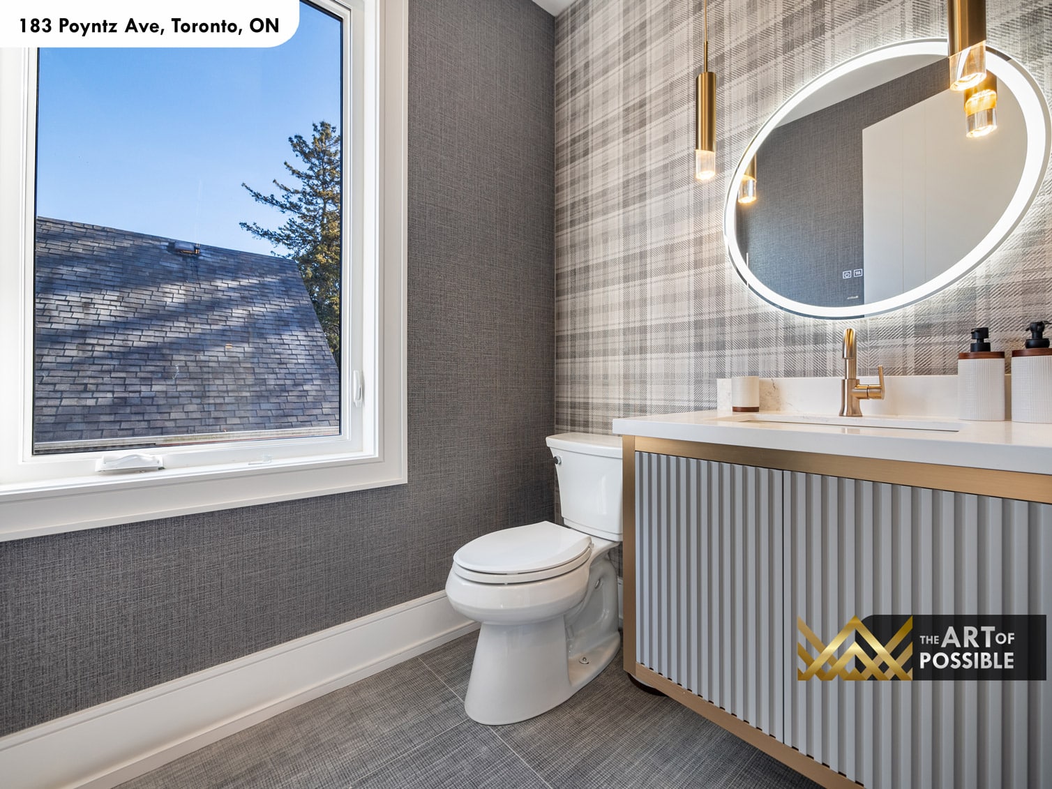 183 Poyntz Ave North York powder room with plaid wallcovering fluted vanity brass fixtures and round backlit LED mirror