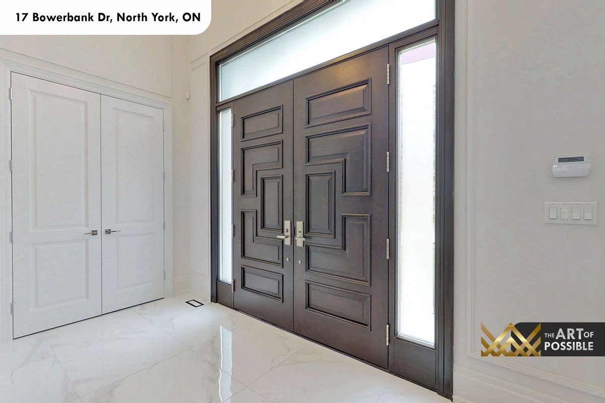 Interior foyer double dark raised-panel entry door with transom and sidelights at 17 Bowerbank Drive