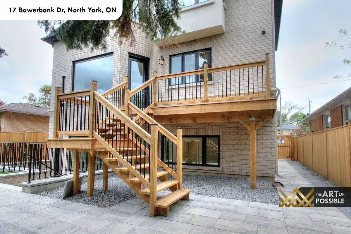 Rear elevation of 17 Bowerbank Drive with elevated wood deck and lower level walkout