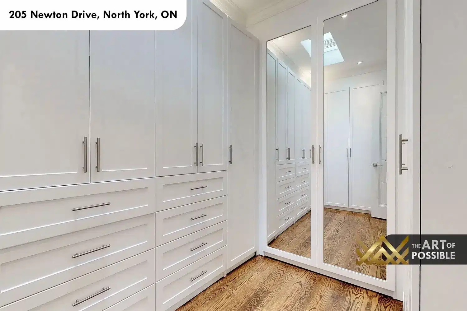 205 Newton Drive walk-in closet white custom cabinetry mirrored doors skylight