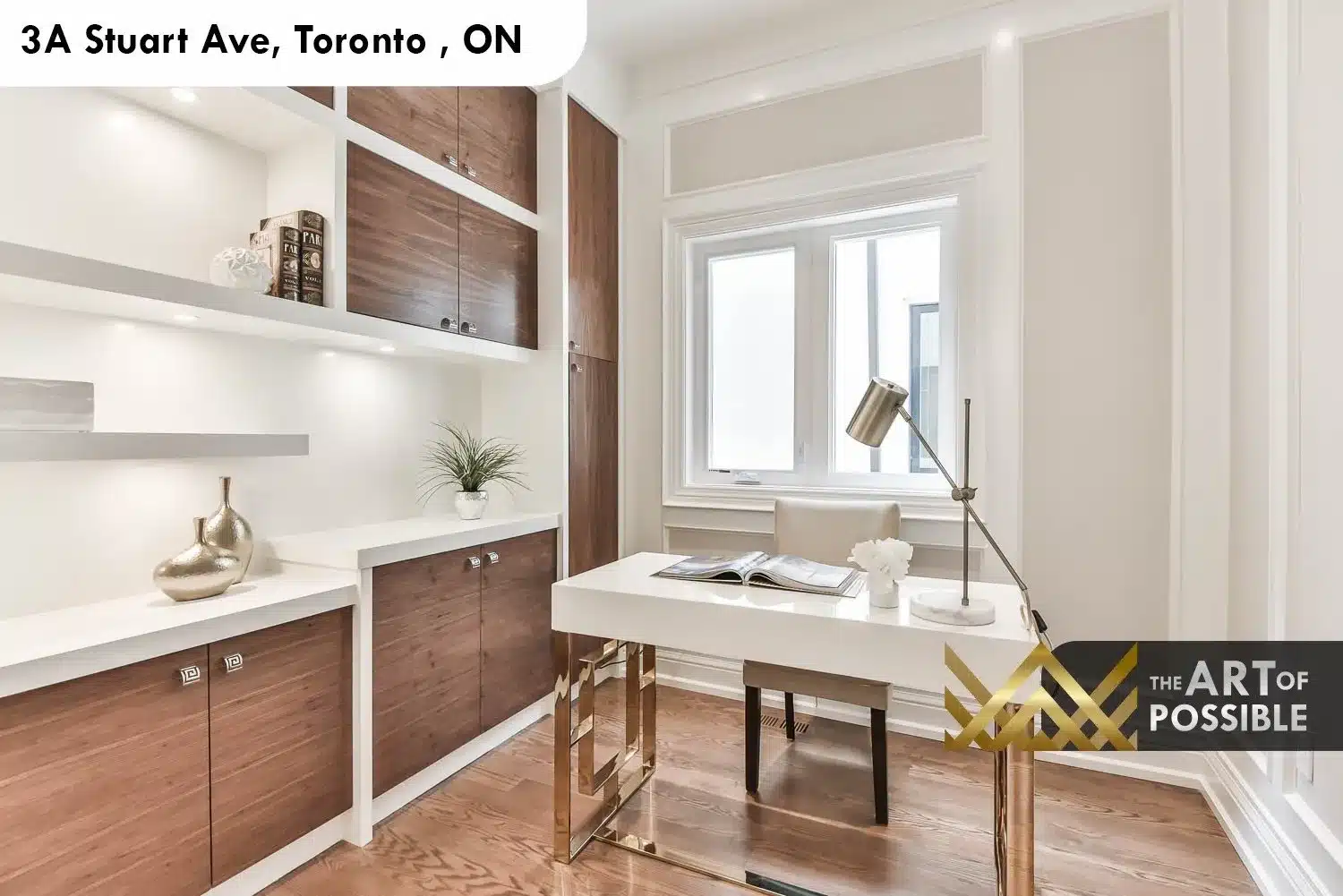 Main floor home office at 3A Stuart Ave with walnut cabinetry, open shelving and floating white lacquer desk