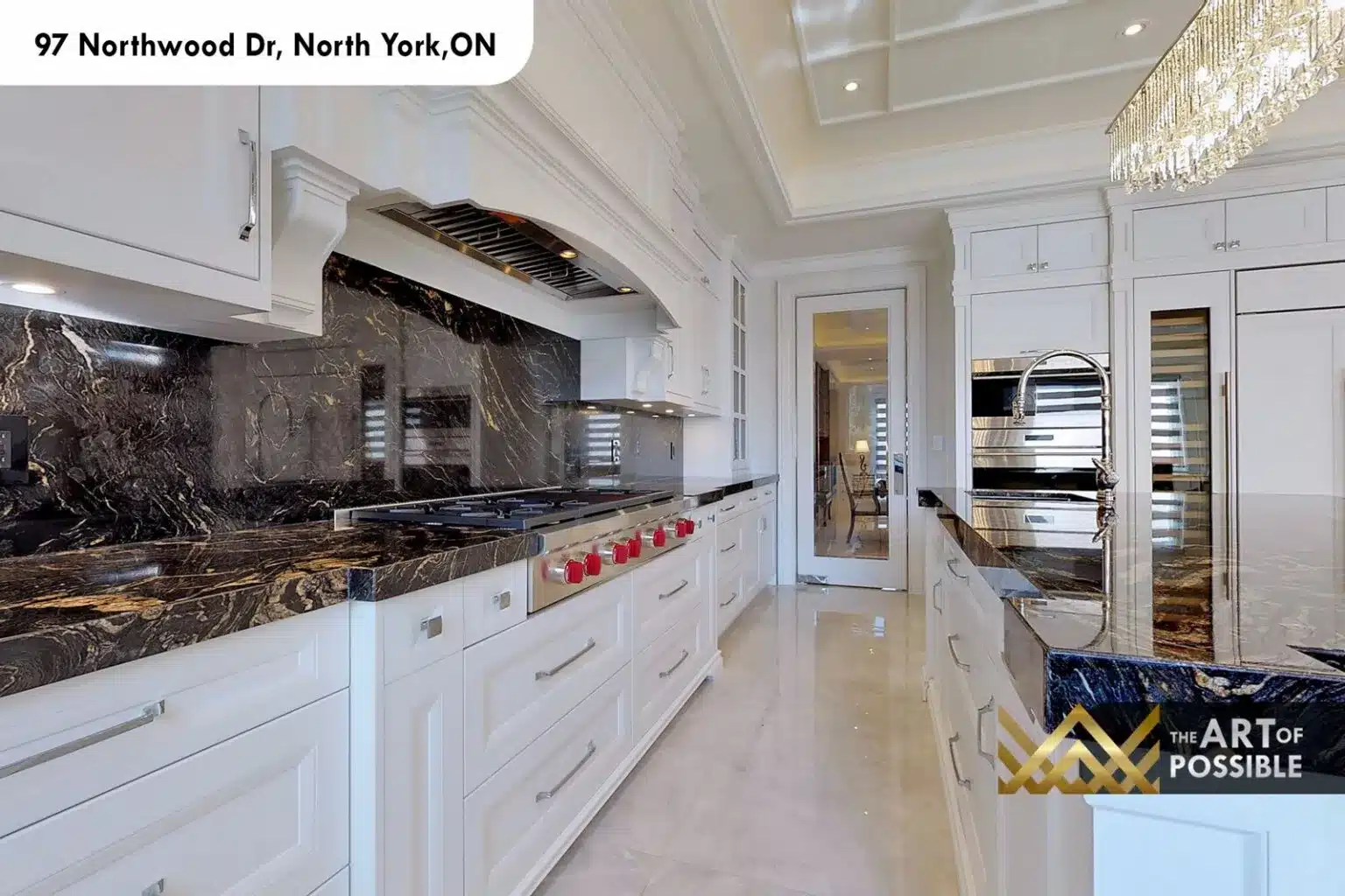 97 Northwood Dr kitchen white shaker cabinetry black marble backsplash gas range red knobs