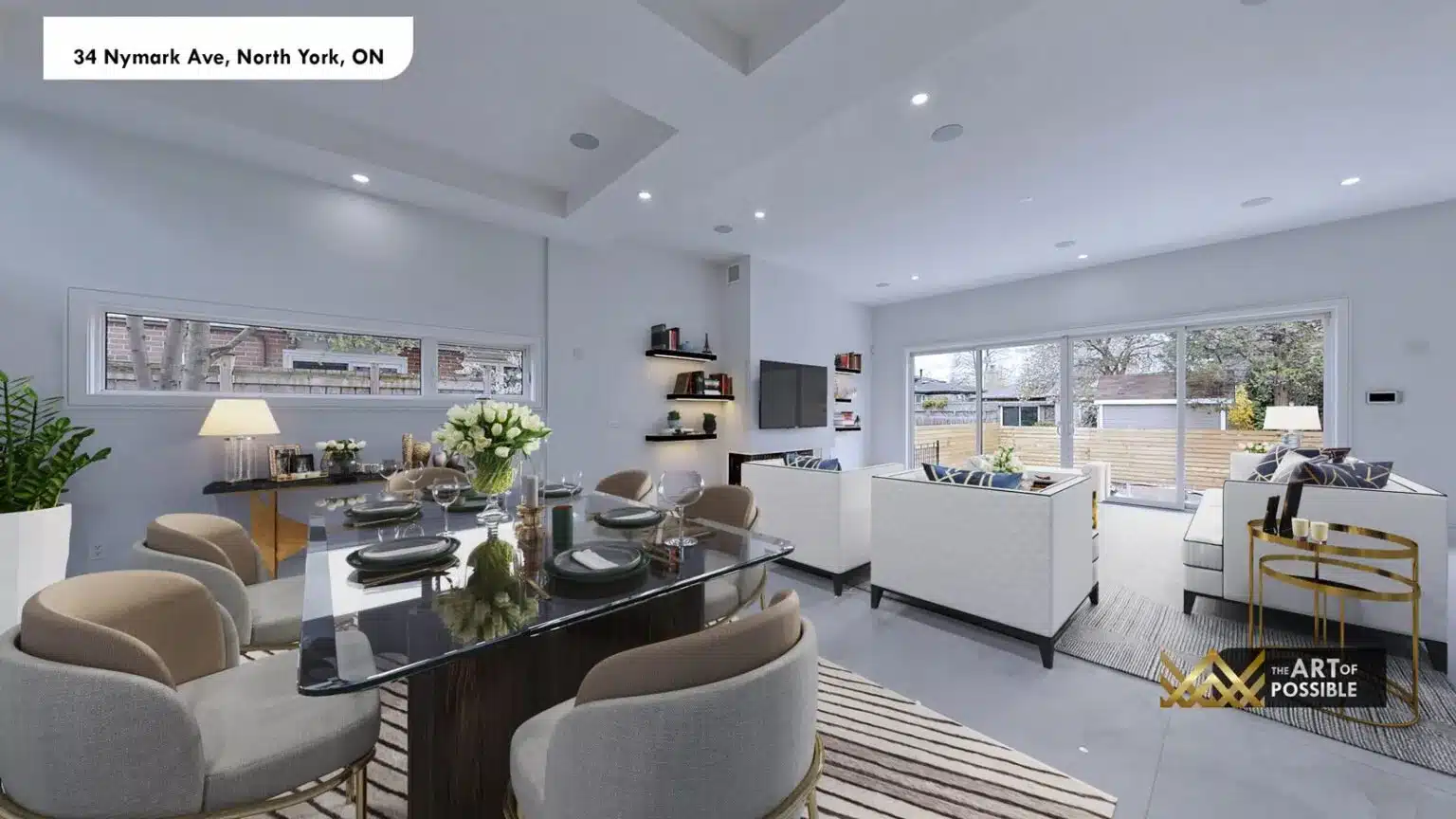 Dining area and living room open plan - glass dining table and sofas with view through to rear sliding glass doors