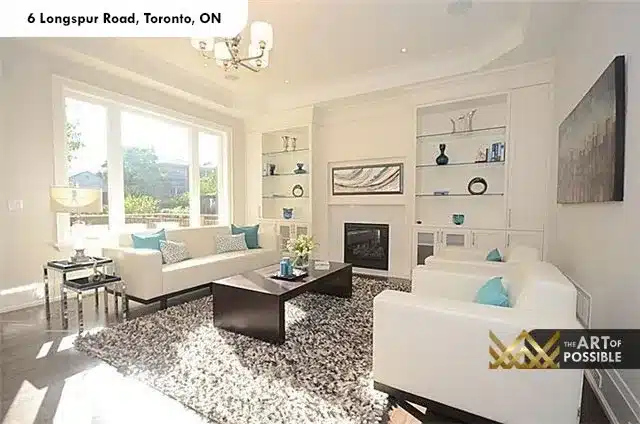 Living room with tray ceiling, white fireplace and flanking built-in shelving at 6 Longspur Rd Toronto