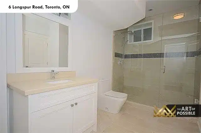 Lower level bathroom with glass shower, mosaic tile accent and chrome fixtures at 6 Longspur Rd Toronto