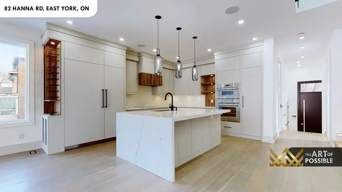 Kitchen with built-in wine rack column and waterfall island at 82 Hanna Rd