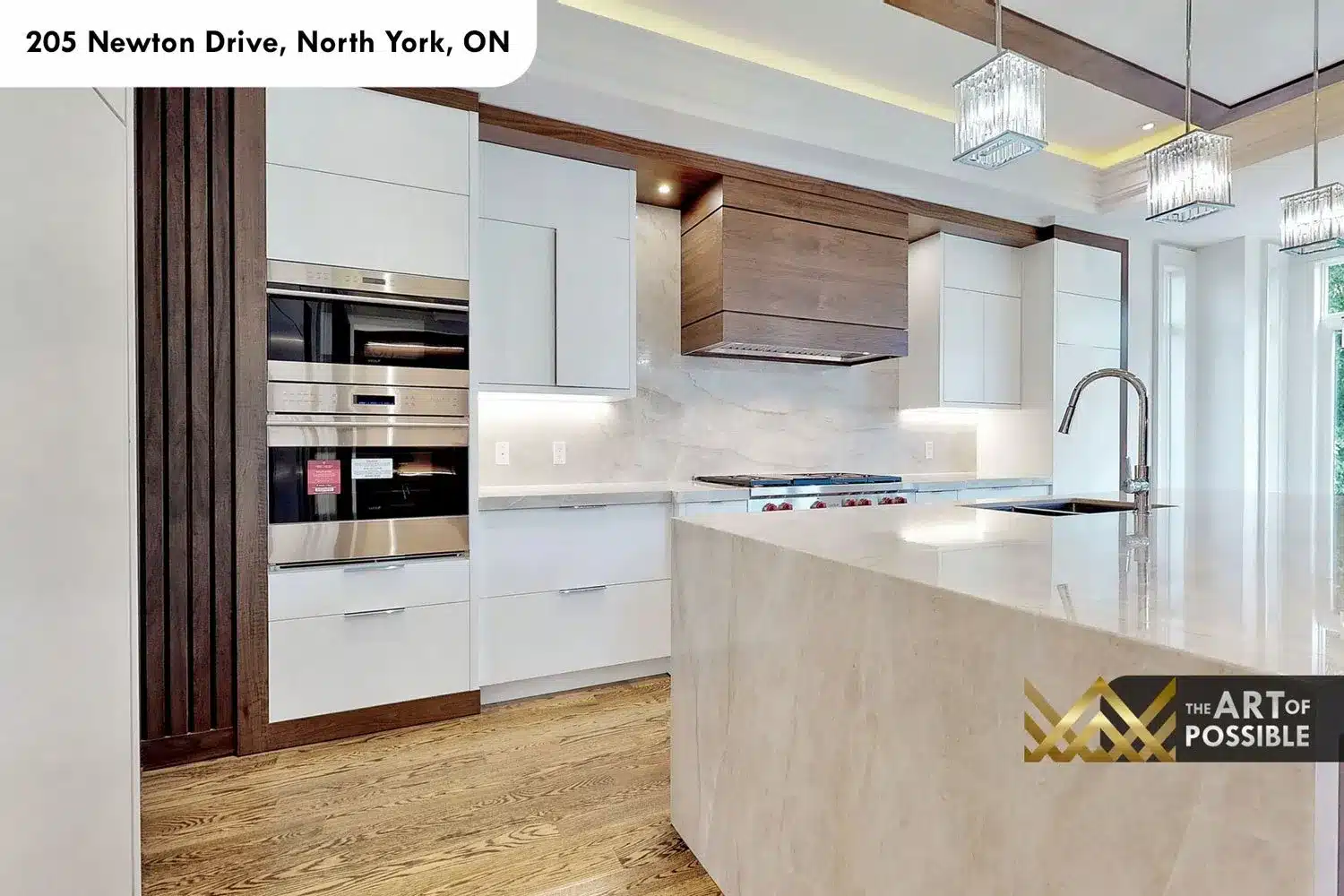 205 Newton Drive kitchen white lacquer cabinetry stainless ovens marble backsplash