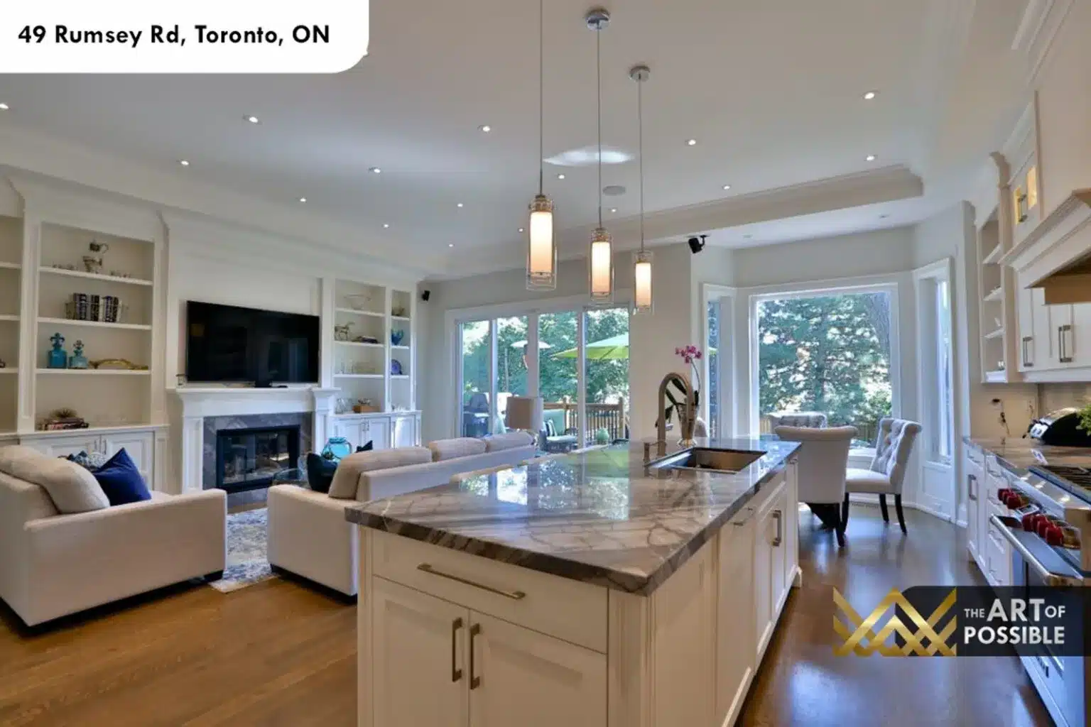 49 Rumsey Rd open concept family room built in shelving fireplace rear deck