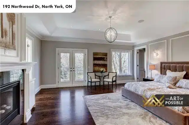 Primary suite with French doors, fireplace and globe chandelier, 192 Northwood Dr