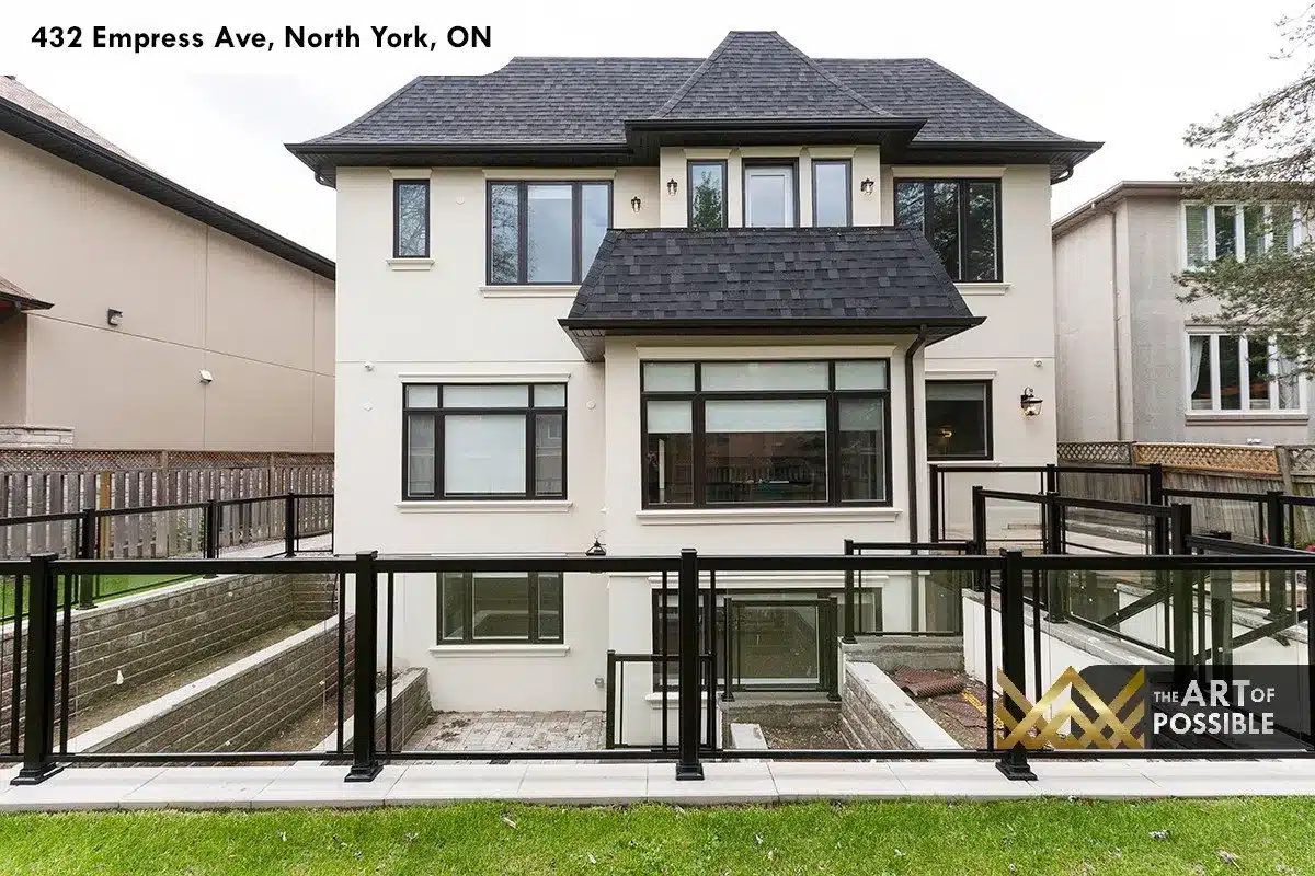 432 Empress Ave - rear elevation with black-framed windows, glass railing deck and walkout