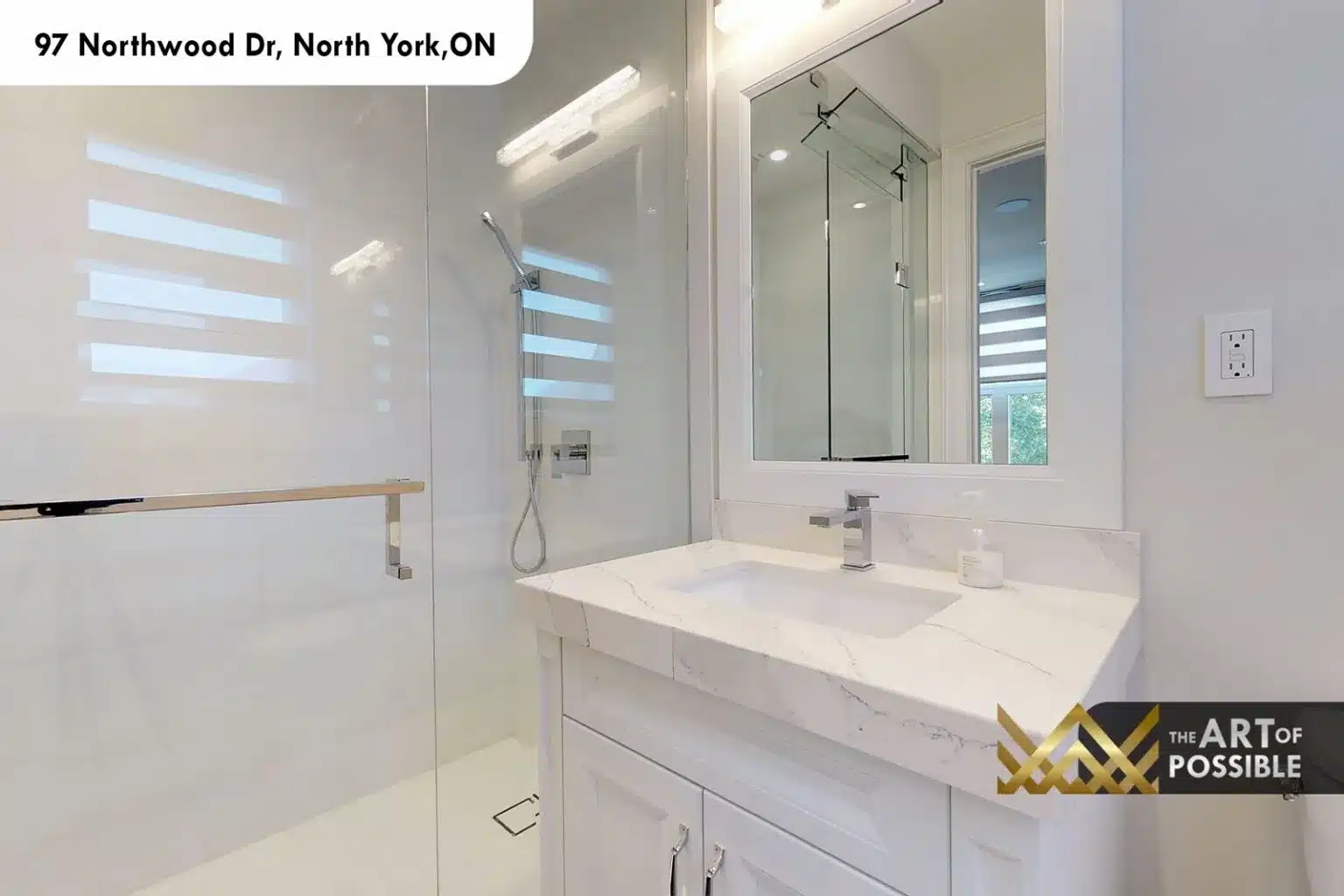 97 Northwood Dr secondary bathroom white vanity marble countertop frameless glass shower chrome fixtures