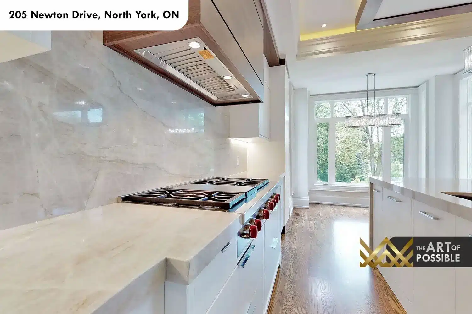 205 Newton Drive kitchen gas range marble slab backsplash walnut range hood
