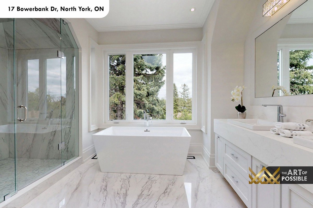 Primary ensuite with freestanding soaker tub at window and glass shower at 17 Bowerbank Drive