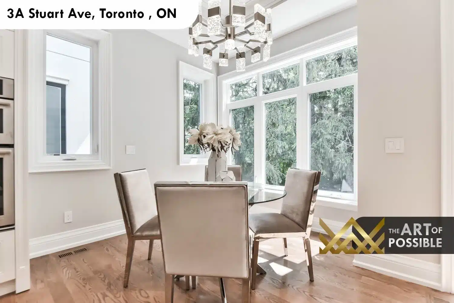 Eat-in breakfast nook at 3A Stuart Ave with picture windows and geometric chrome chandelier