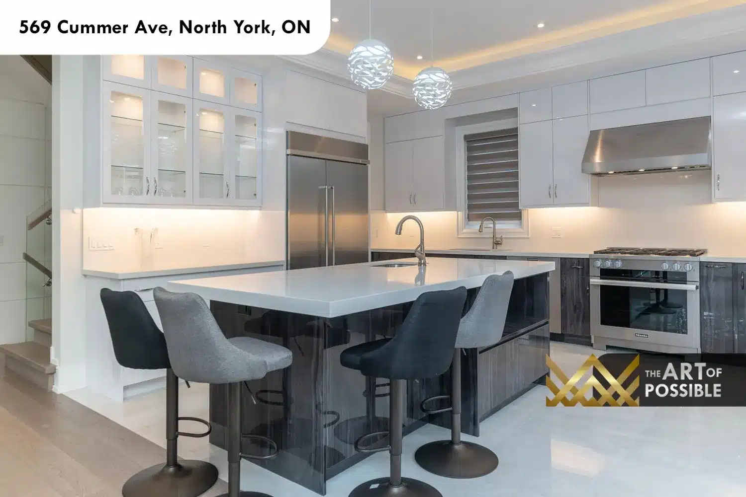 569 Cummer Ave kitchen two tone white gloss dark wood cabinets quartz island bar stools