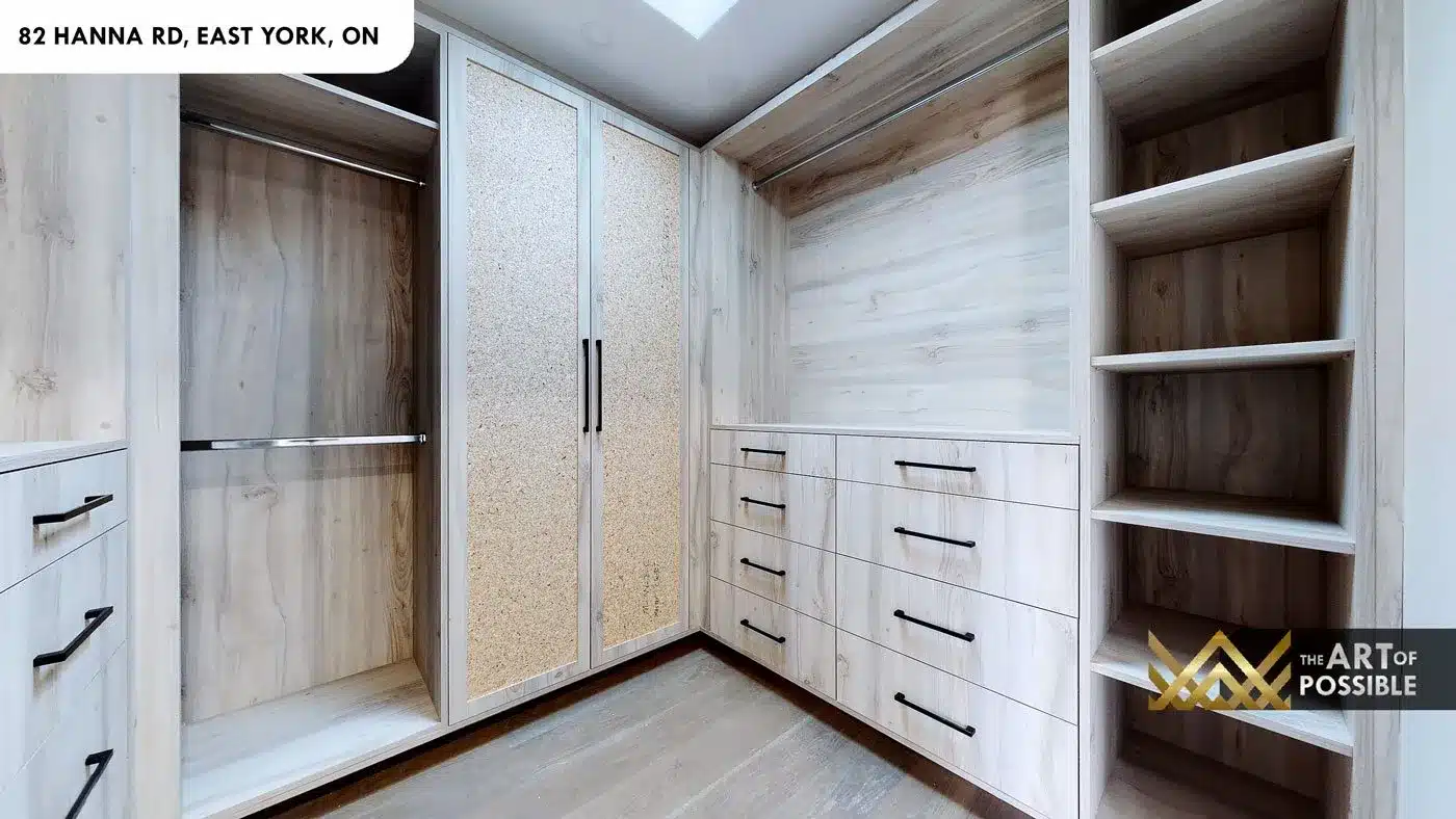 Custom walk-in closet with cane-panel doors and built-in drawers at 82 Hanna Rd