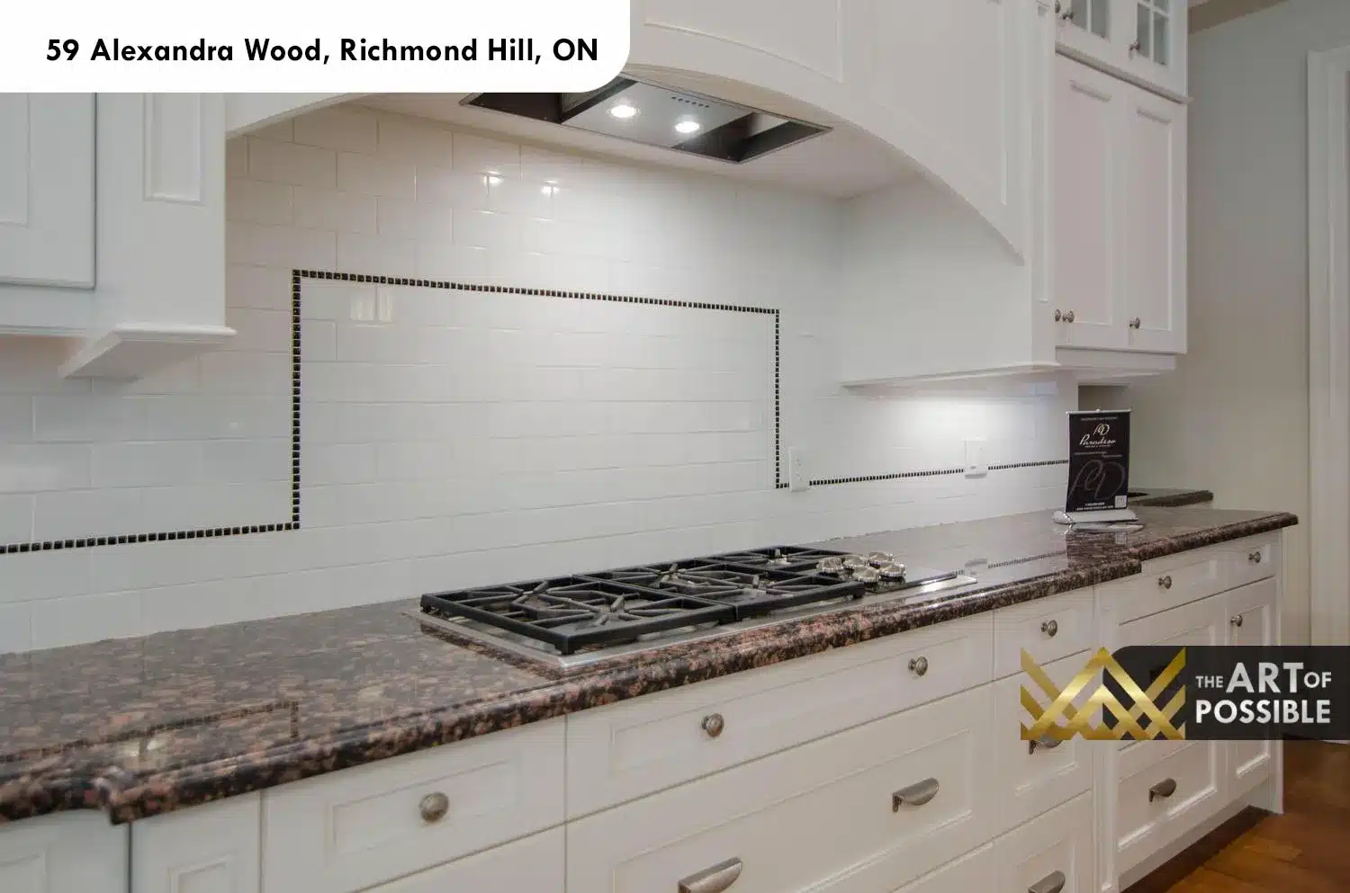 59 Alexandra Wood North York kitchen gas cooktop subway tile backsplash black mosaic border arched hood