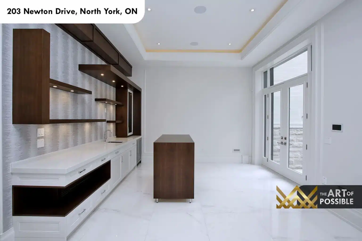 Lower level wet bar with walnut shelving, white quartz counter and walnut island