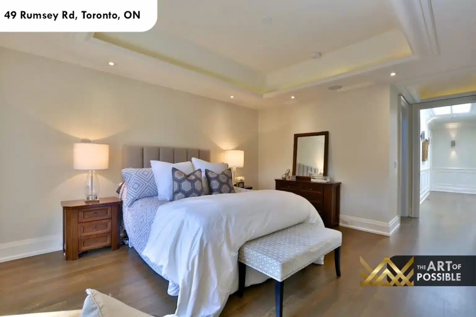 49 Rumsey Rd primary bedroom tray ceiling hardwood floors ensuite doorway