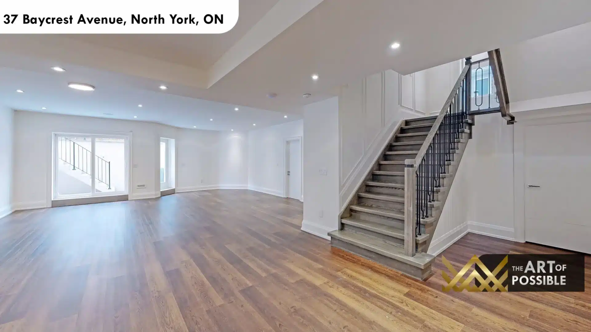37 Baycrest Ave lower level rec room walkout sliding doors grey staircase black iron balusters wine cooler