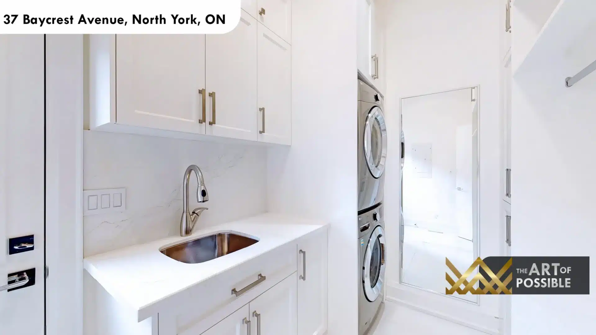 37 Baycrest Ave upper floor laundry stacked LG washer dryer white cabinetry quartz countertop gold hardware