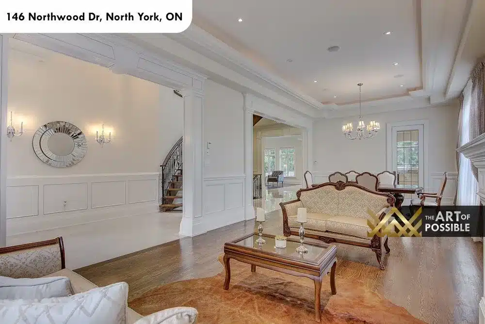 Formal living and dining rooms at 146 Northwood Dr with marble fireplace and tray ceilings