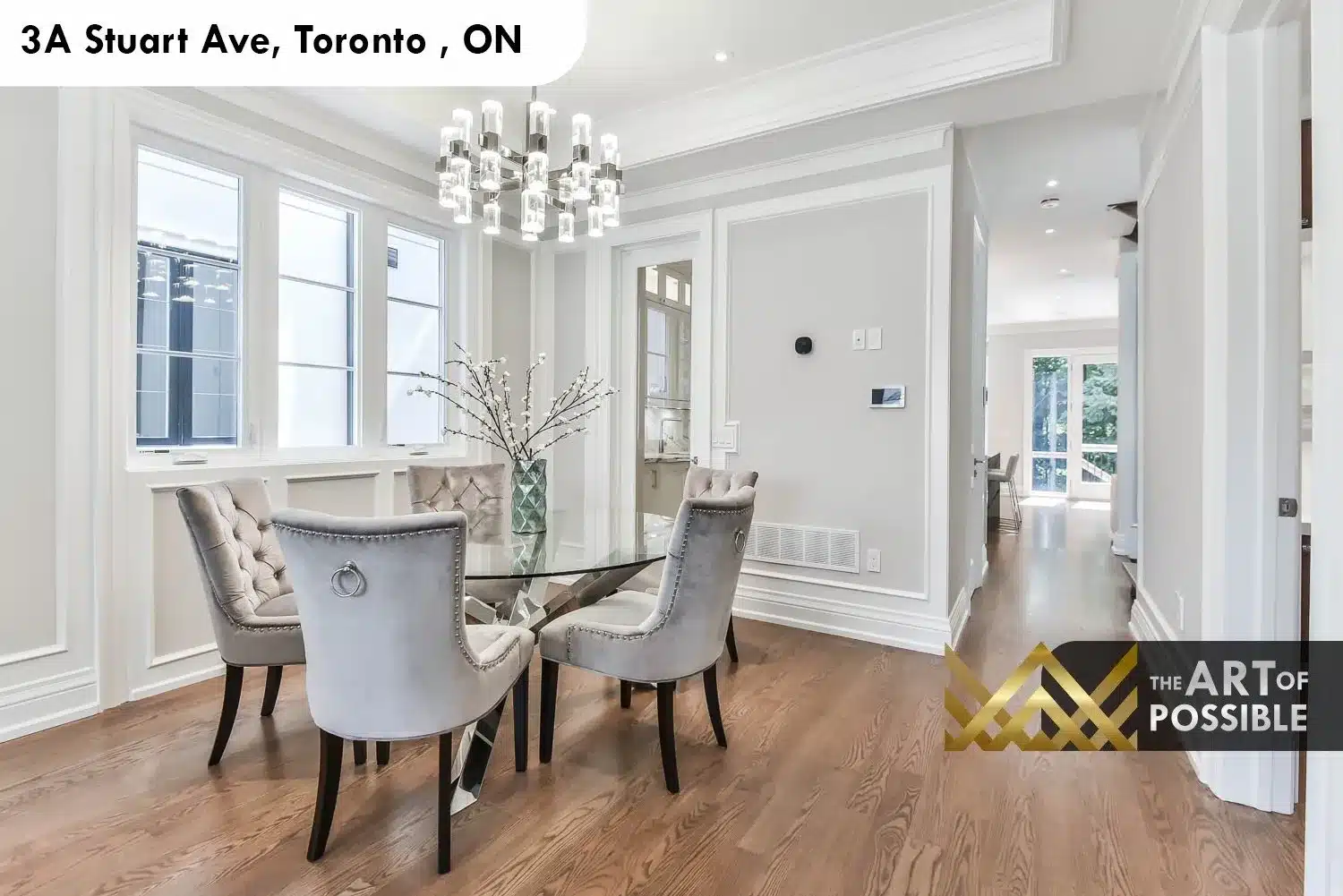 Dining room at 3A Stuart Ave with geometric chrome chandelier and tray ceiling with panel moulding