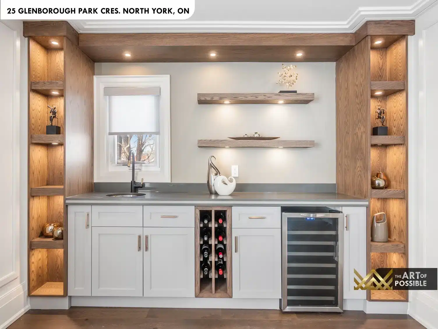 Main floor home office with floor-to-ceiling built-in shelving