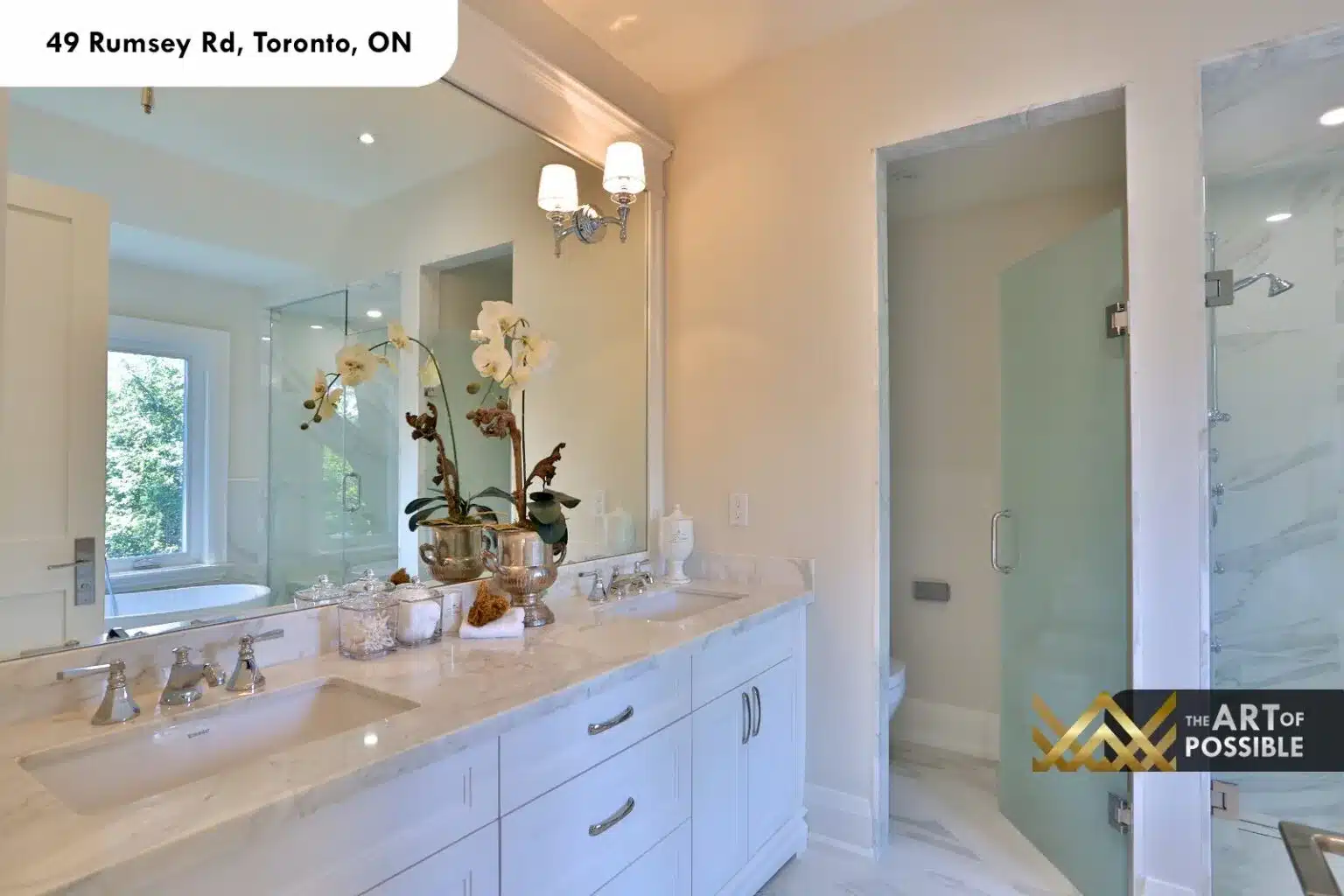 49 Rumsey Rd primary ensuite double vanity marble countertop glass shower freestanding tub