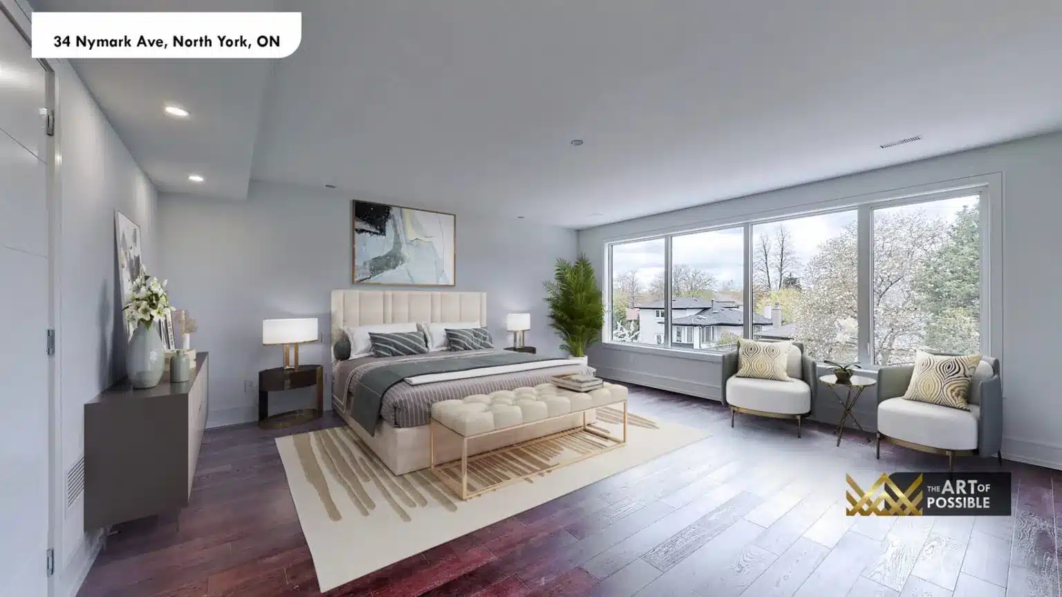Primary bedroom with large three-panel windows, dark espresso hardwood floors and seating area
