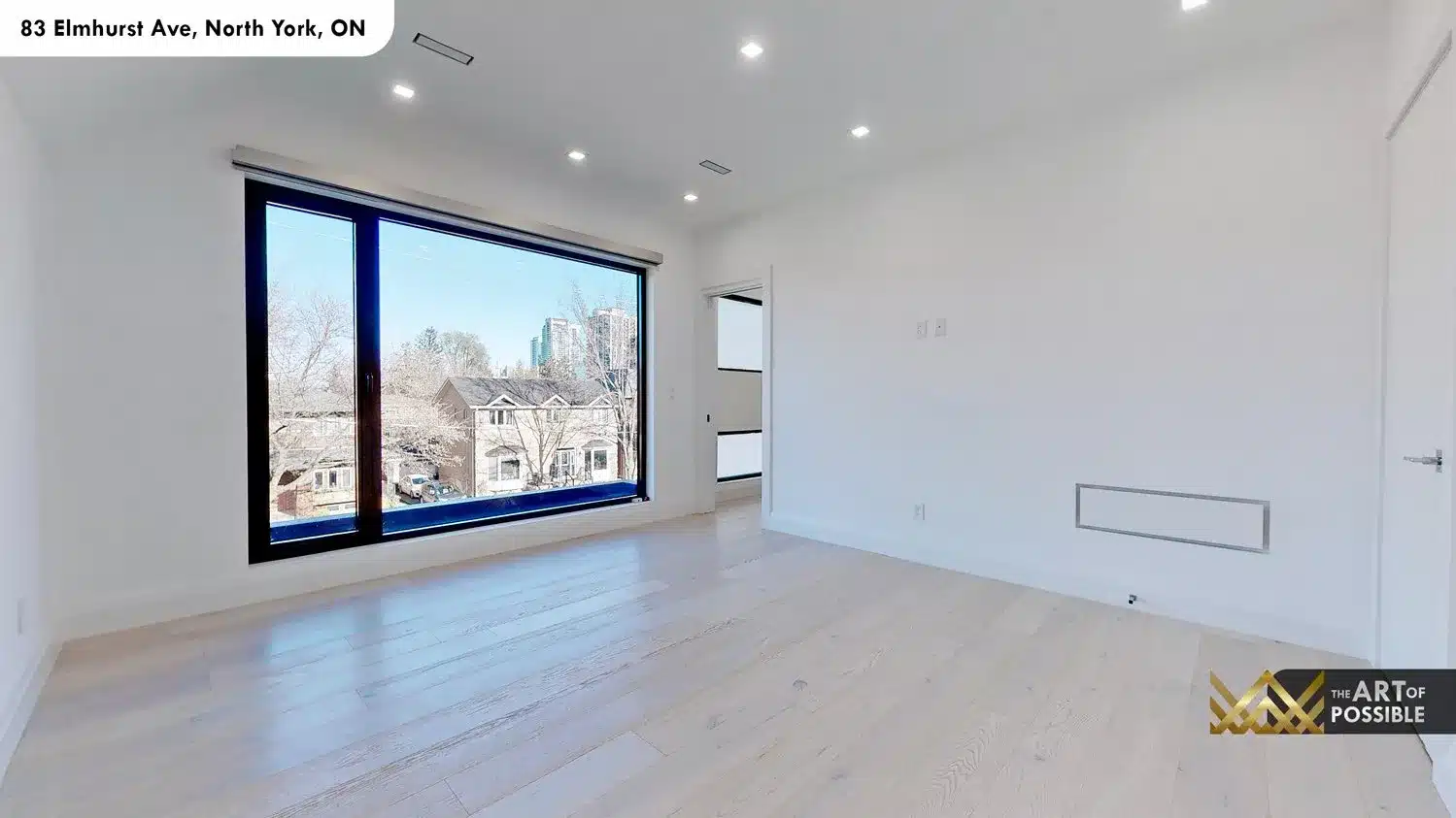 83 Elmhurst Ave North York primary bedroom hardwood floors picture window