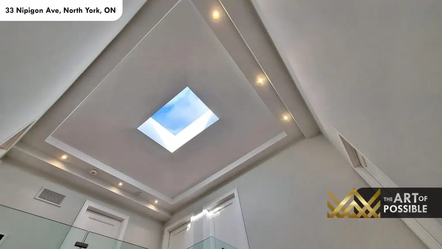 Square skylight above tray ceiling in walk-in closet corridor