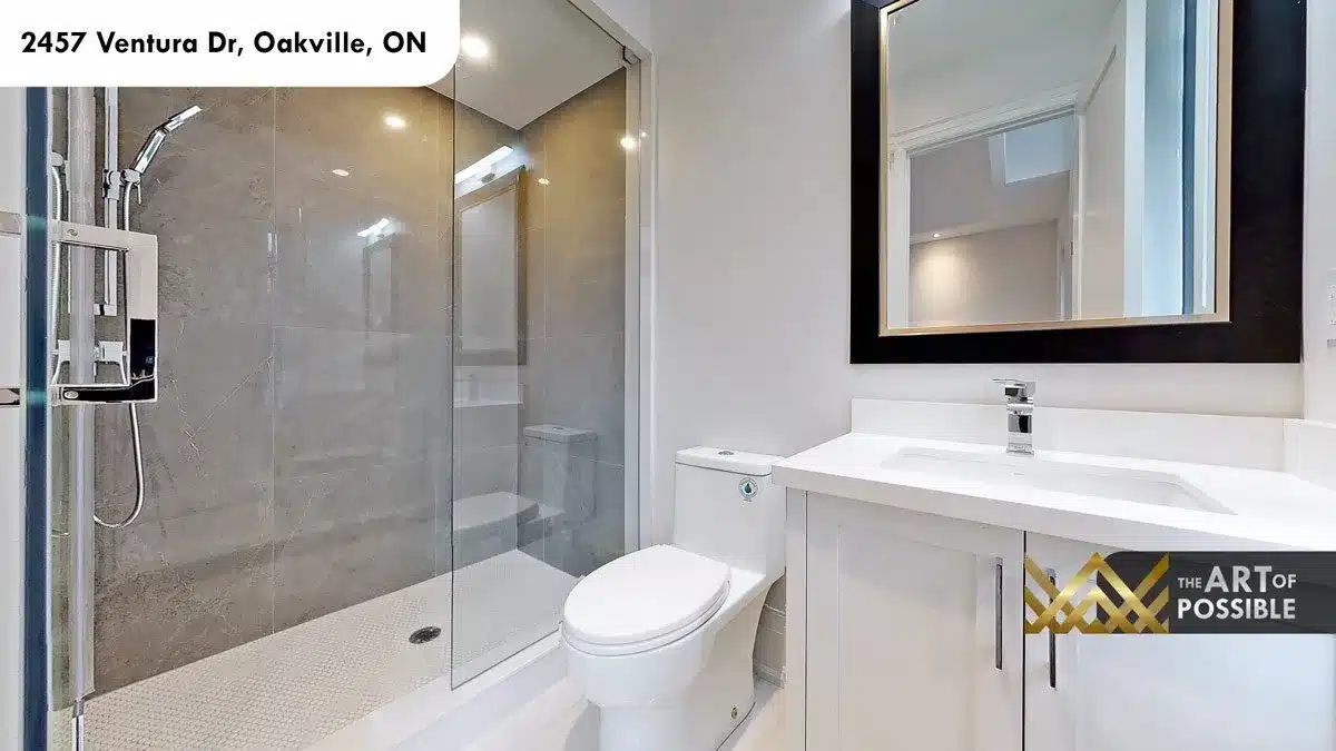 Upper floor bathroom with grey marble tile shower penny tile floor and chrome fixtures