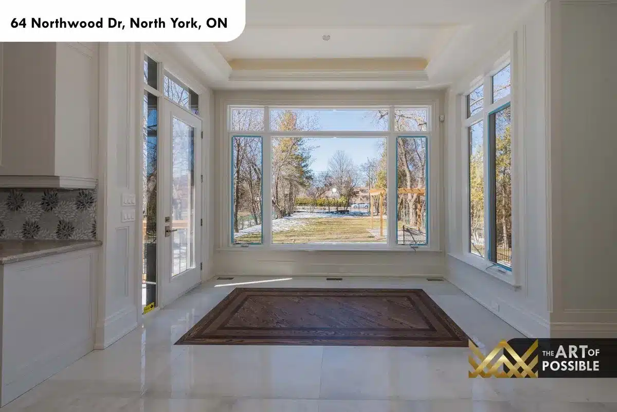 Breakfast room with floor-to-ceiling windows and French doors to rear yard