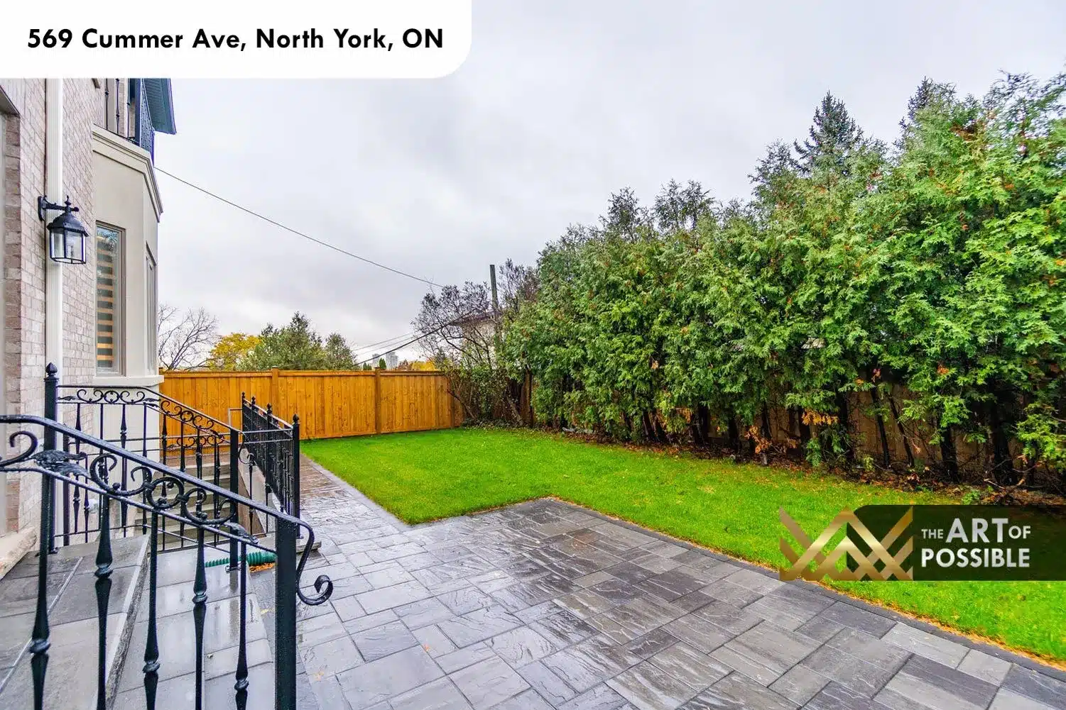 569 Cummer Ave backyard stone paver patio wrought iron railing lawn privacy fence