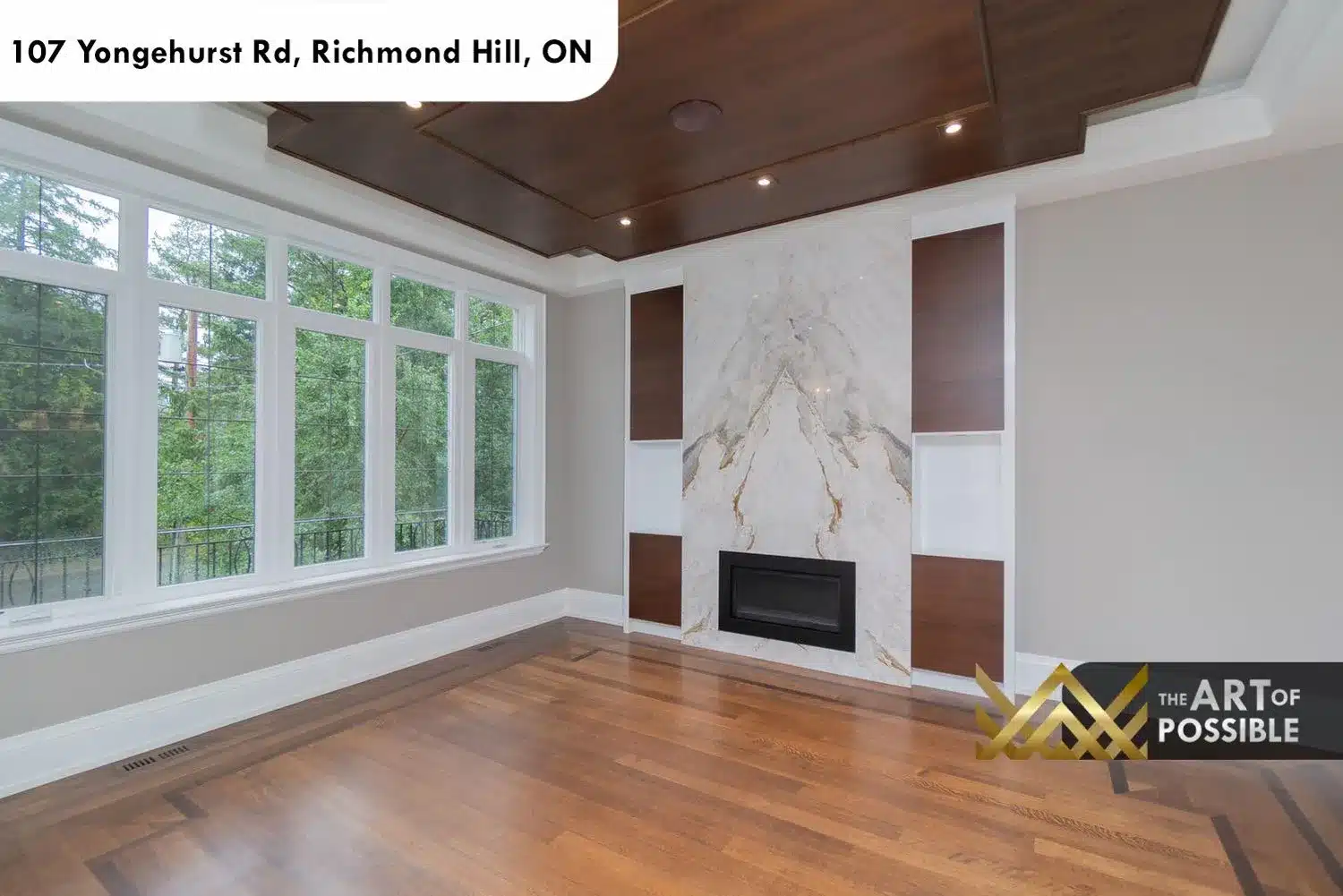 Living room marble fireplace with gold-veined slab surround and dark walnut accent panels