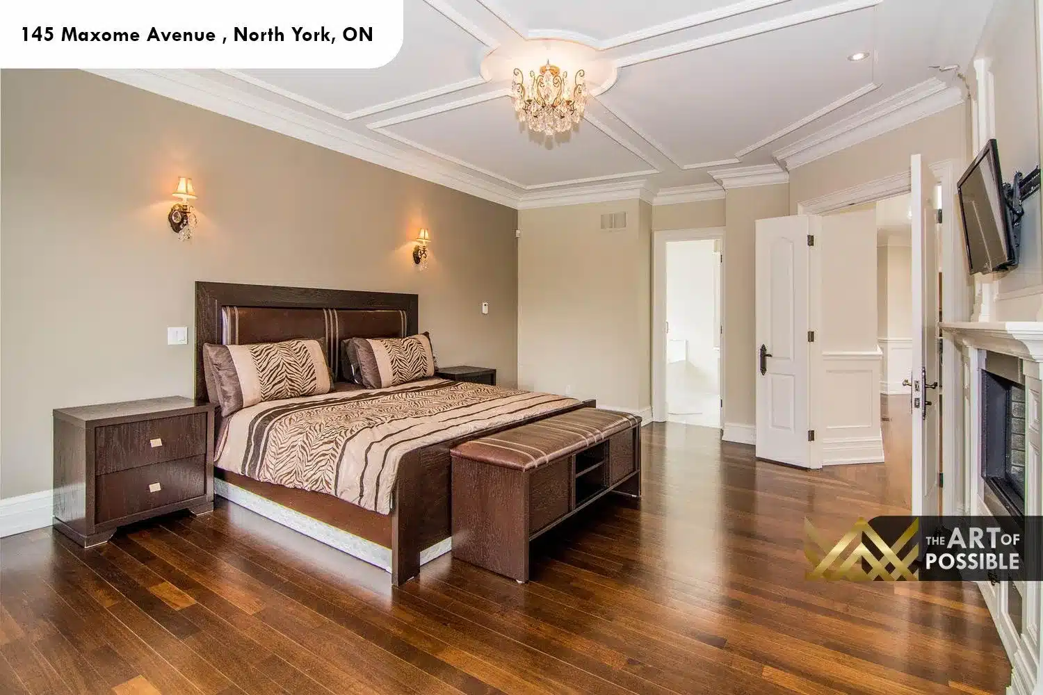 145 Maxome Avenue primary bedroom coffered tray ceiling crystal chandelier fireplace built-in