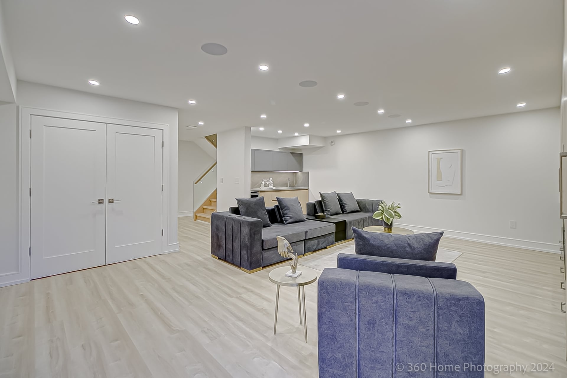 Basement recreation room at 100 Glenvale Blvd with wet bar and double storage closet