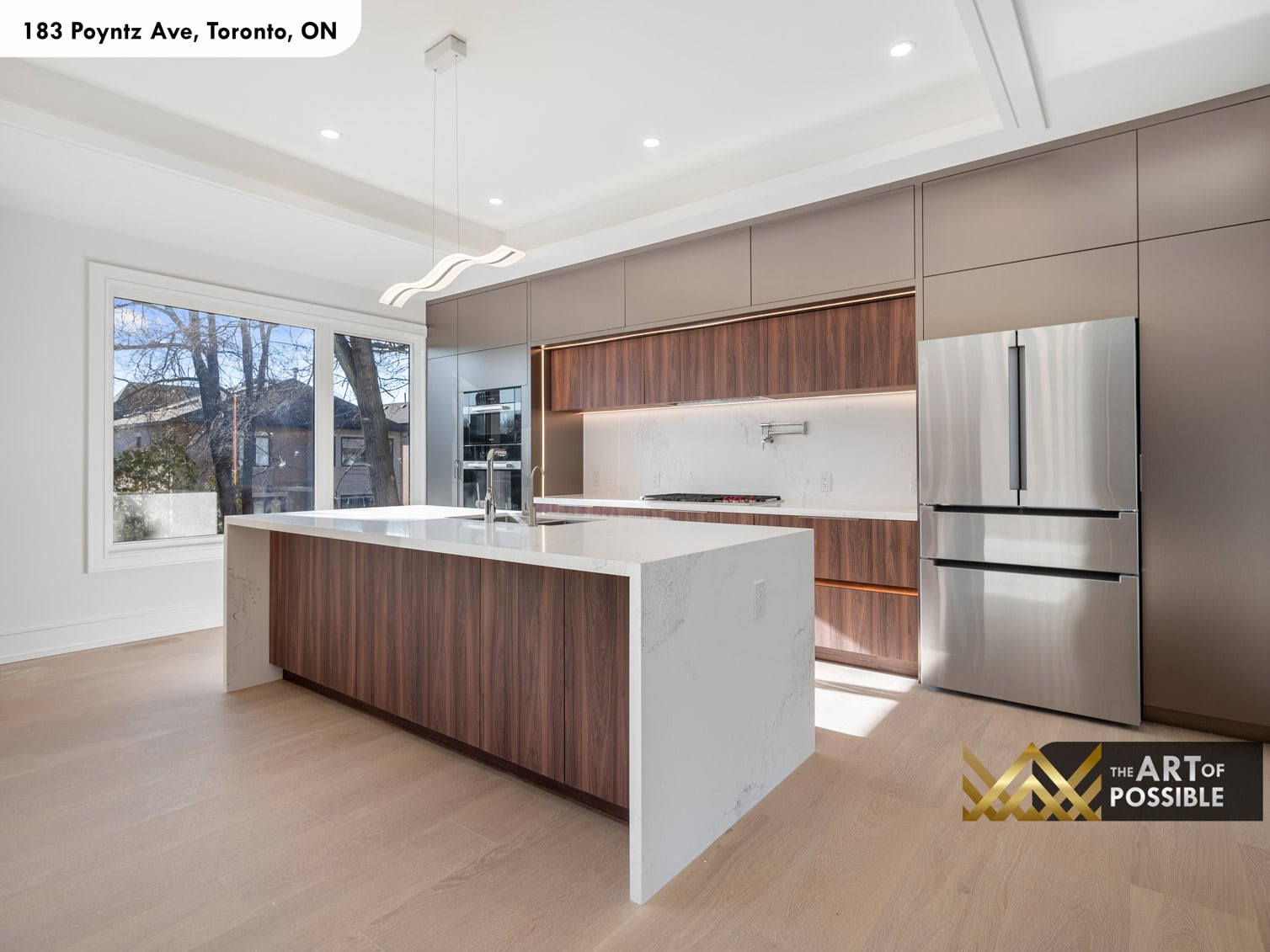 183 Poyntz Ave North York kitchen wide view showing walnut island marble countertop and French door refrigerator